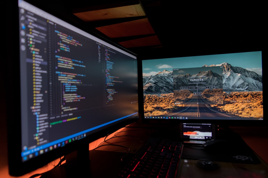who-we-are two-black-flat-screen-computer-monitors-lj9ky8pih3e